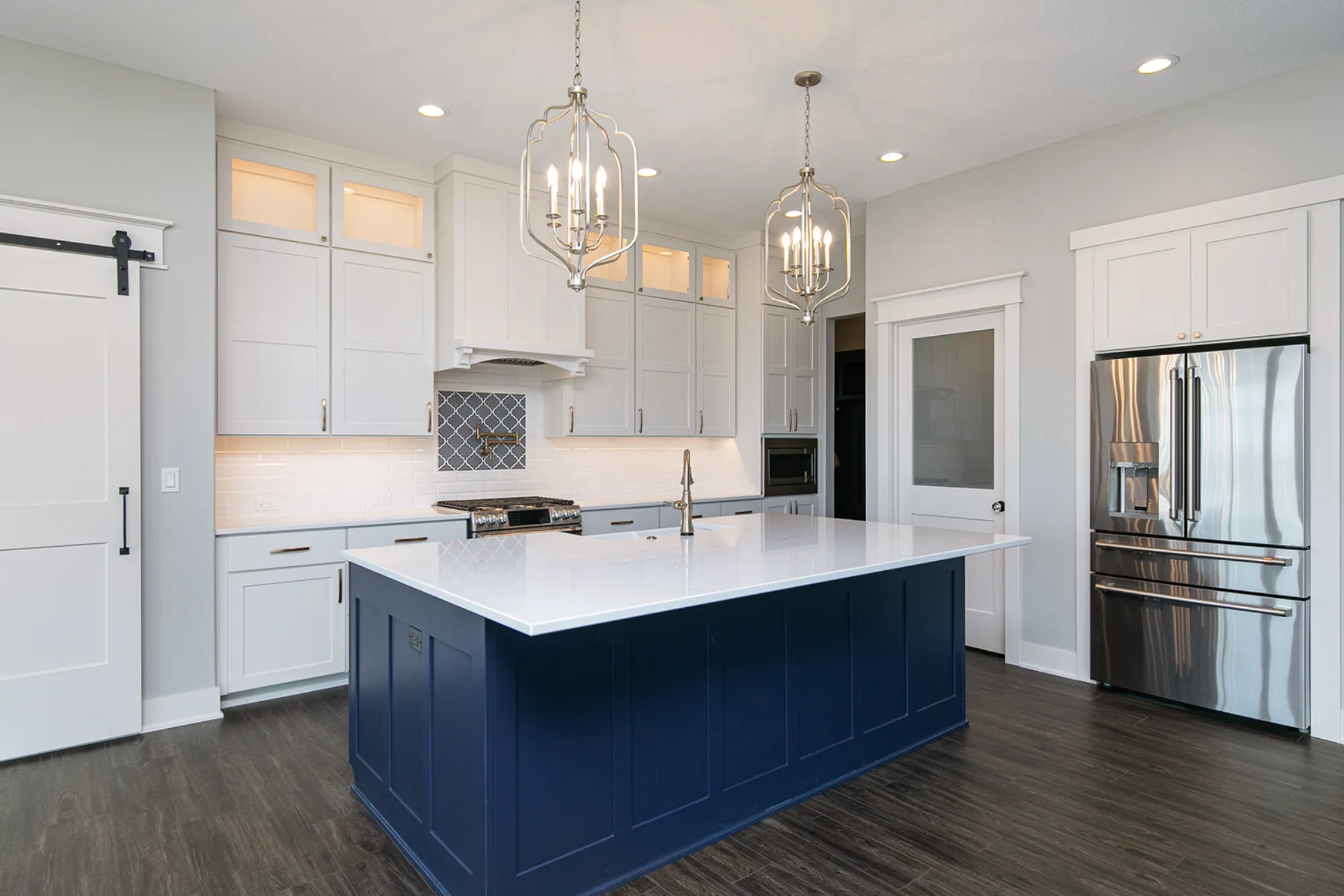 White Quartz Kitchen with Navy Island Cabinet